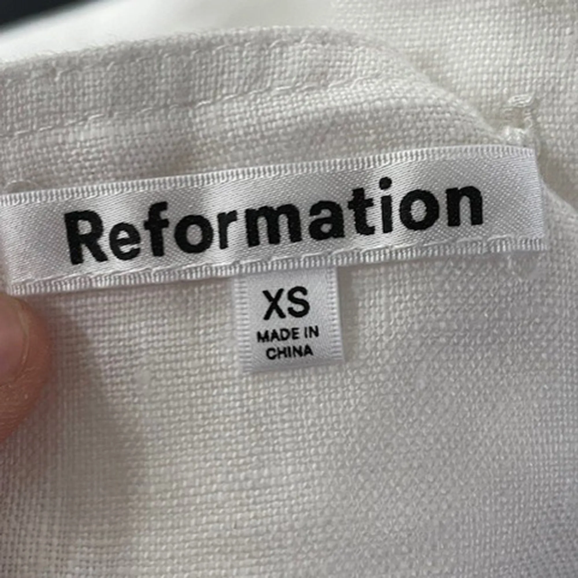 Reformation Buttoned Crop Top in White Cotton