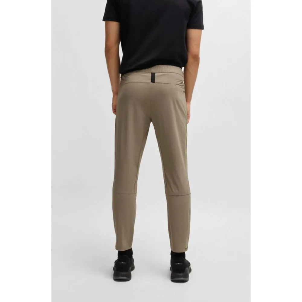 Tapered-leg trousers in water-repellent stretch fabric
